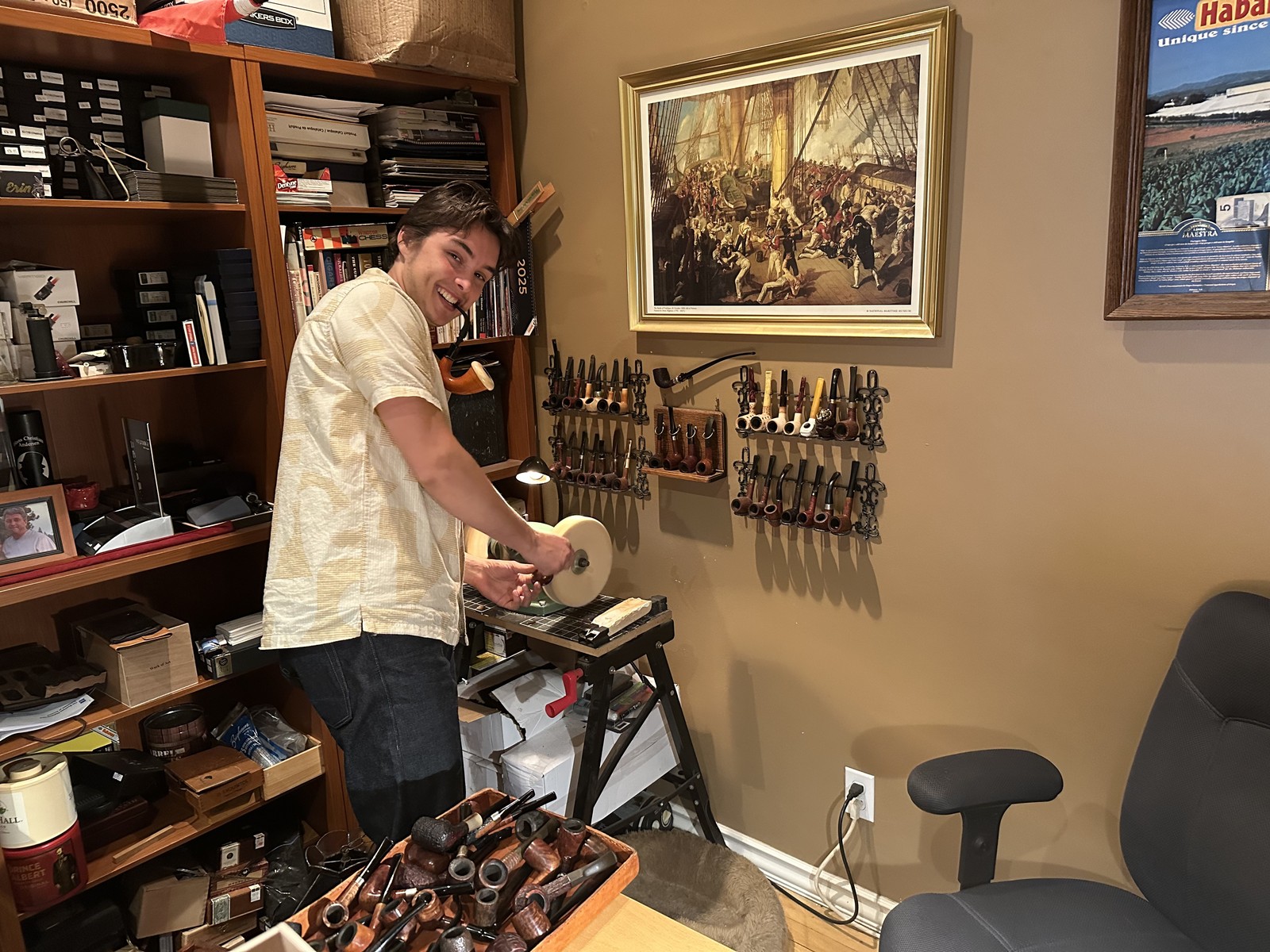 Leo in his workshop, surrounded by pipes, tools, and shelves of the archive